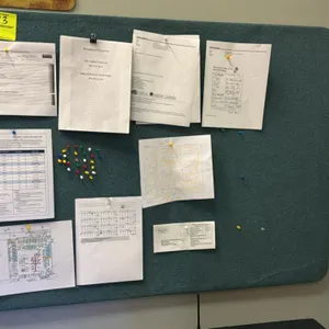 Office boards. Includes (2) 4' bulletin/cork boards and (1) 3' dry erase board. Features one fabric-wrapped board, one cork board with wood frame, and