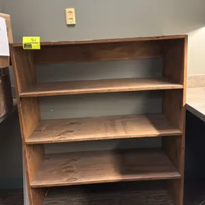 Wood multi-tier shelving unit. Features fixed wood shelves and an open-back frame. 44"L x 20"W x 51"H.