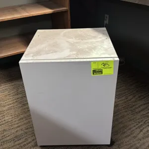 Metal mobile printer stand cabinet. Features a faux-stone laminate top, single hinged door, and an interior shelf. 18" x 18" x 26". Mounted on casters