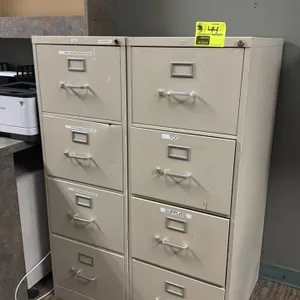 HON 4-drawer vertical file cabinets. Features metal construction with a beige finish, four pull-out drawers with silver-tone handles, and integrated l