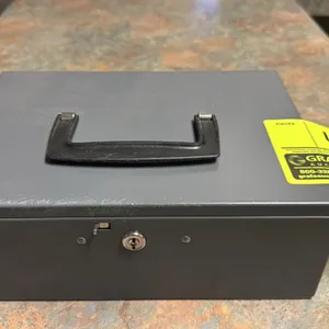 Metal cash box. Features top carrying handle, key lock latch, and removable multi-compartment interior plastic organizer tray. Includes (2) keys. 10 1