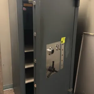 Heritage Mark I combination safe. Features dial combination lock, key-locking mechanism with keys, dual interior AMSEC deposit drop compartments with 