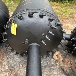 42" barrel reamer. Features cylindrical welded steel body, carbide bullet cutting teeth, integrated fluid nozzles, and hardfaced wear bands. Adjacent 