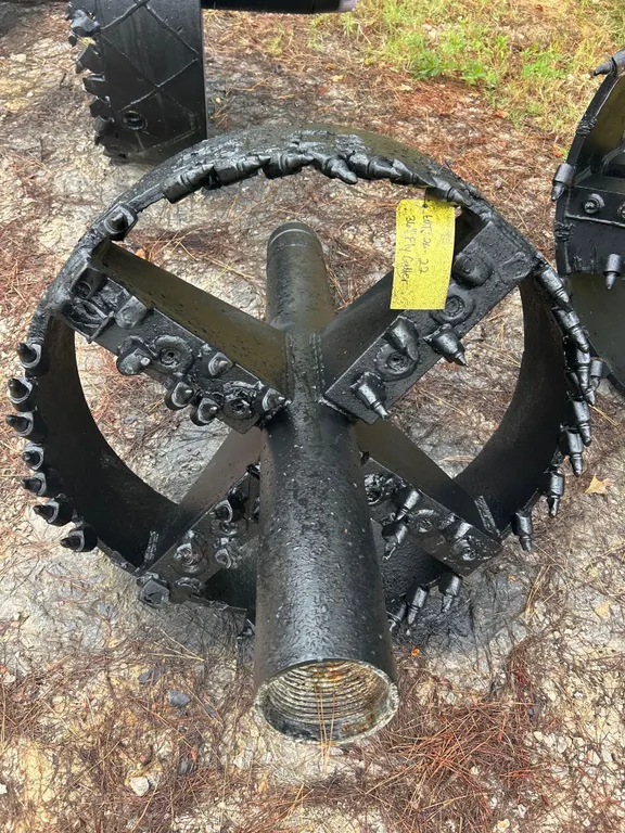 36" fly cutter HDD reamer. Features welded steel ring and spoke construction, carbide bullet cutting teeth, and threaded box connection.