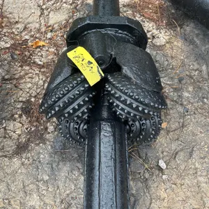 26" TCI hole opener rock reamer. Features tungsten carbide insert (TCI) roller cones and fluted body shaft.