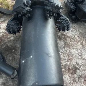 60" mill tooth reamer with barrel centralizer. Features roller cone cutters with milled teeth, centralizer barrel body, spiral fluted stabilizer secti
