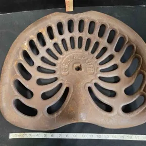 Champion implement seat, cast iron, vintage