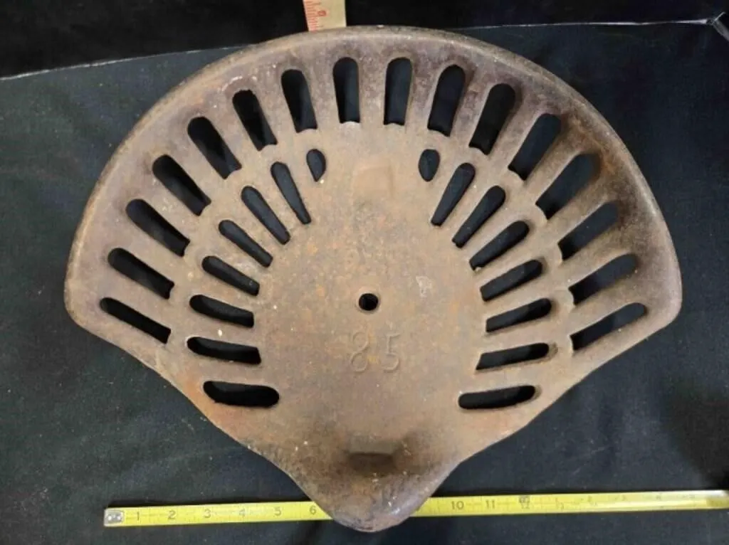 Implement seat, antique, stamped 85