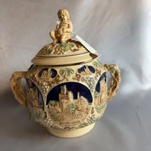 German Stoneware Covered Tureen With Cherub Finial and Relief Castle Decoration