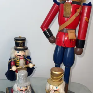 Four Decorative Nutcracker Figures Including Mountie and Drummer Designs