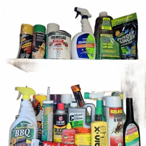 Household Cleaners, Lubricants, and Repair Products in Wooden Cabinet