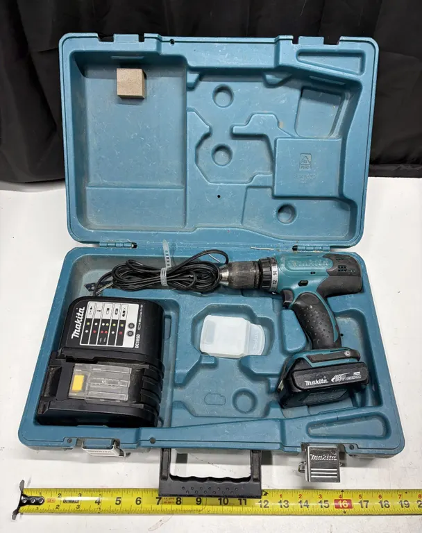 Makita Drill with charger and case. (Working)