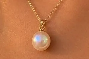 $150, 14kpeg, gold plated bail pearl.pendant, retail value $150