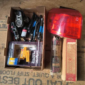 Assorted Automotive Parts Lot: GMC Terrain Tail Light Assembly, Mityvac Brake Bleeding Kit, Spark Pl