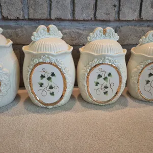 FOUR WHITE CERAMIC CANISTERS
