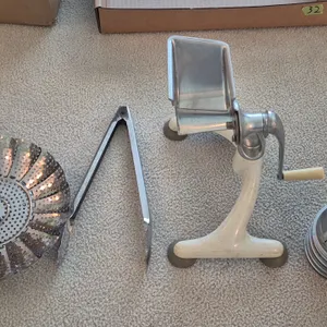 VINTAGE MANUAL FOOD SLICER, VEGETABLE STEAMER BASKET, AND TONGS