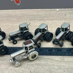 7, 1:64 White Tractors.