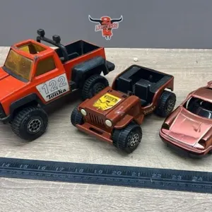 2 Small Tonka Toys and a Plastic Car.
